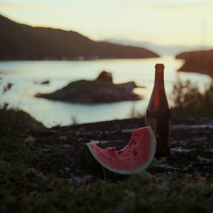A bottle of water in a stylish dark environment.