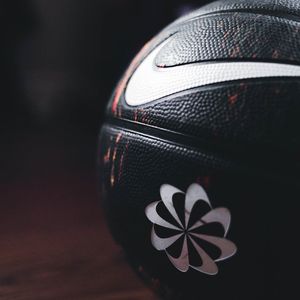 Close up of sports equipment on a dark floor.