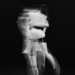 Rhythmic motion blur of a person exercising.